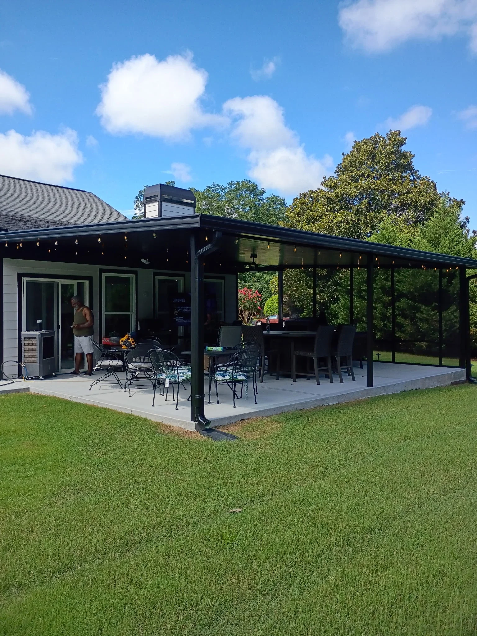 Aluminum patio cover structure attached to residential home