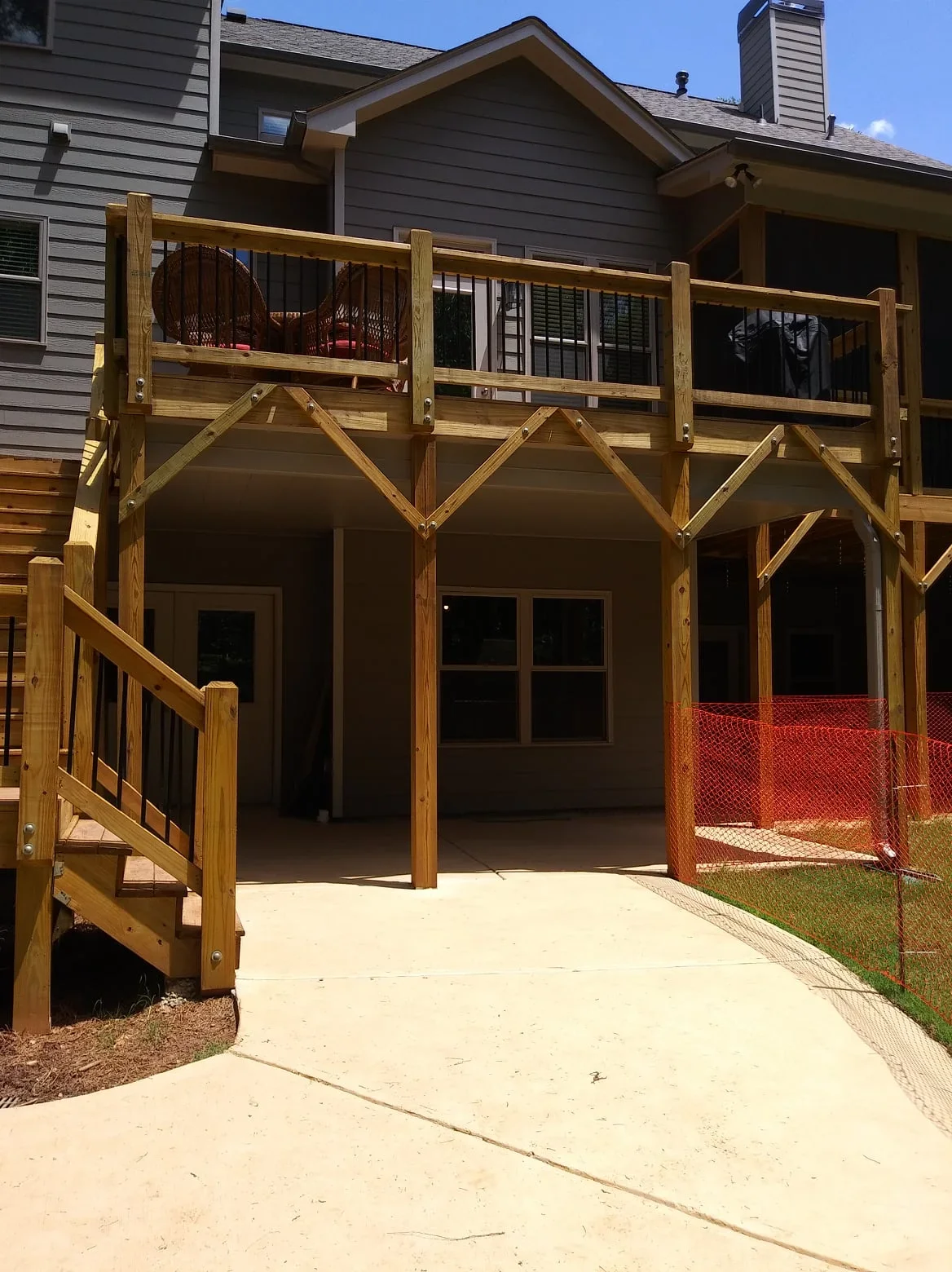 Two-story timber frame screen room with X-bracing, full screening, and under-deck ceiling system