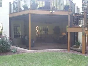 Large screened room addition on deck with aluminum frame and full screening